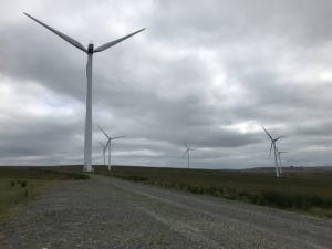 Wind turbines across a Welsh moorland landscape at Mynydd y Gwair