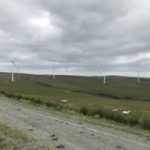 Wind turbines across a Welsh moorland landscape at Mynydd y Gwair